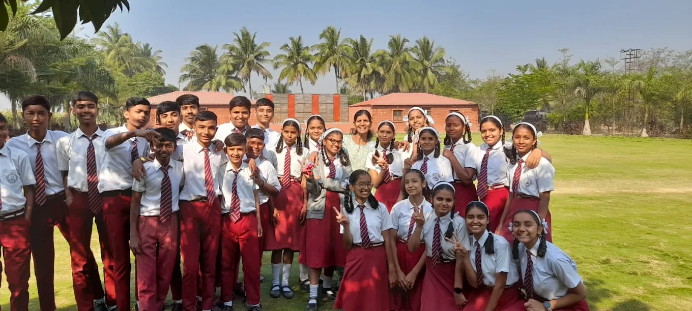 Students with their teacher on a school field trip