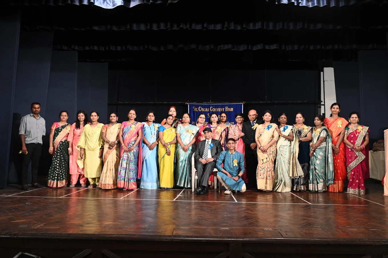 School staff on stage during the annual function